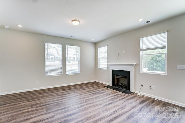 unfurnished living room featuring wood-type flooring