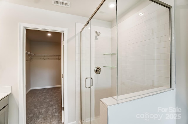 bathroom with vanity and an enclosed shower