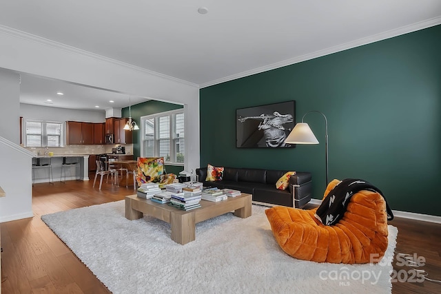 living room with ornamental molding and dark hardwood / wood-style flooring