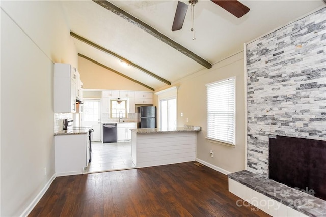 unfurnished living room with sink, dark wood-type flooring, vaulted ceiling with beams, and ceiling fan