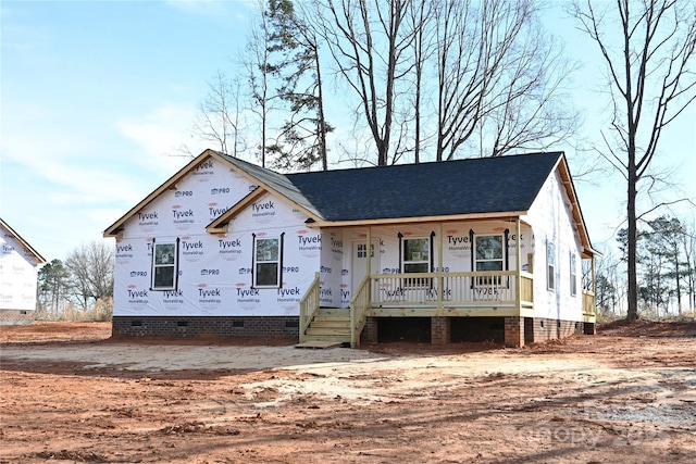 unfinished property featuring crawl space, a porch, and a shingled roof