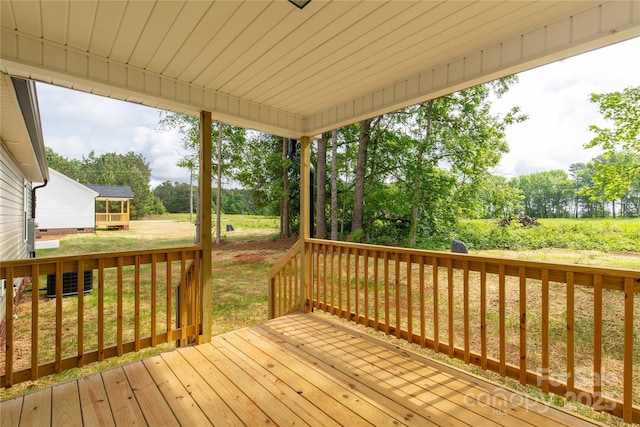 wooden deck with a yard