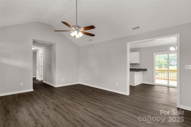 unfurnished living room with ceiling fan, visible vents, vaulted ceiling, and dark wood finished floors