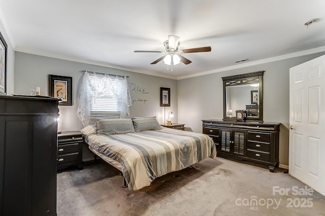 bedroom with ceiling fan, light colored carpet, and ornamental molding