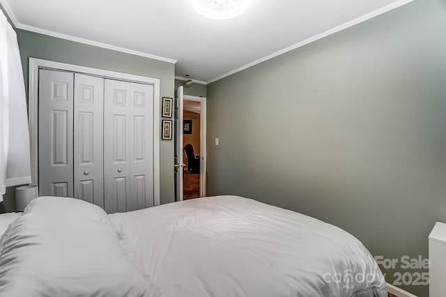 bedroom featuring ornamental molding and a closet