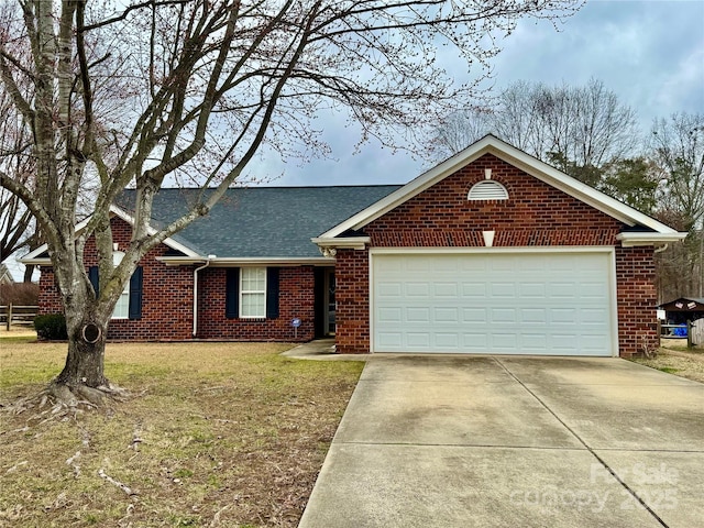 ranch-style house with a garage and a front lawn