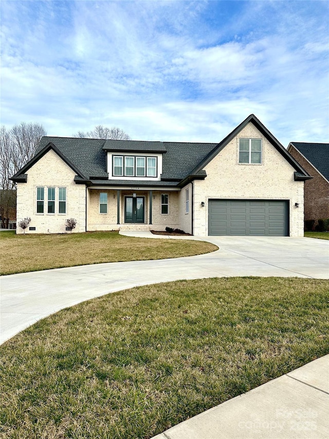 view of front facade with a garage and a front yard