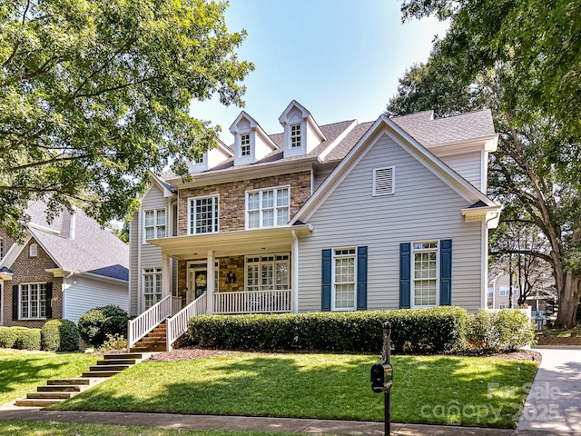 colonial house with a porch and a front lawn