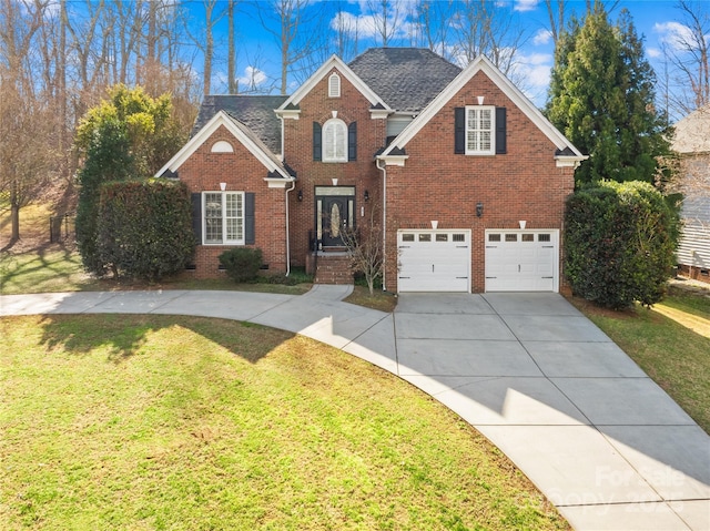 traditional-style home featuring driveway, a front lawn, an attached garage, and brick siding