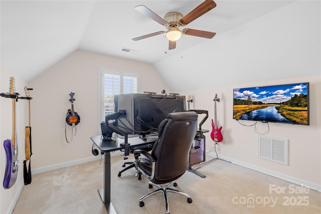 home office with light carpet, baseboards, visible vents, and lofted ceiling