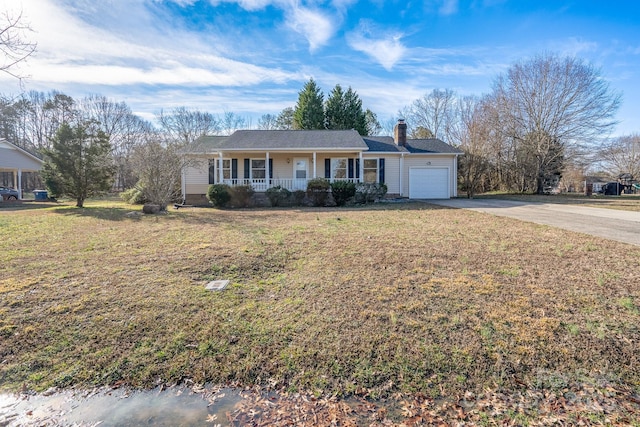 single story home with a porch, a garage, and a front yard