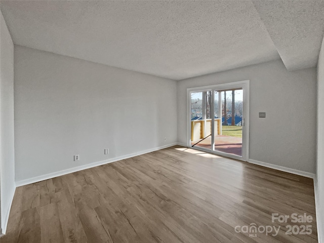 26017 Misty Way Dr, Fort Mill, SC 29708 - unfurnished room featuring wood-type flooring and a textured ceiling