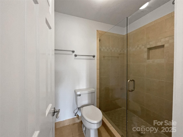 26017 Misty Way Dr, Fort Mill, SC 29708 - bathroom featuring tile patterned flooring, a shower with door, and toilet