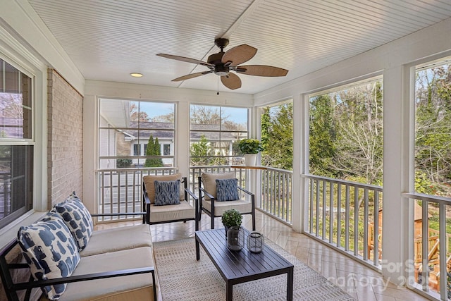 sunroom with a ceiling fan