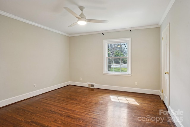 unfurnished room with baseboards, visible vents, a ceiling fan, wood finished floors, and crown molding