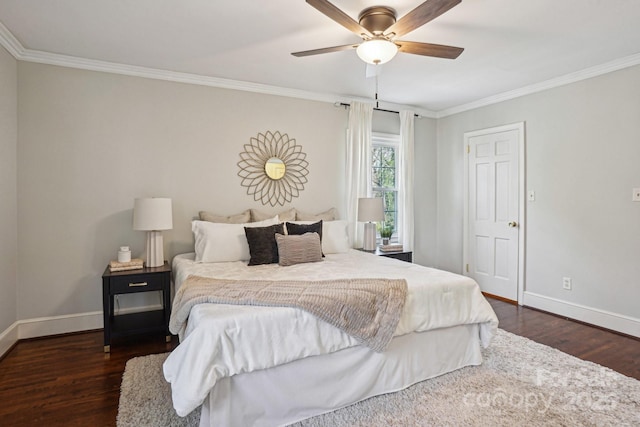 bedroom featuring ornamental molding, dark wood-style flooring, and baseboards