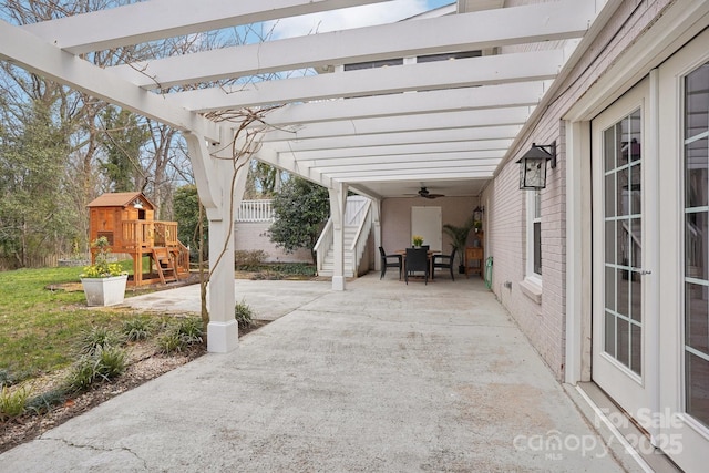 view of patio featuring a pergola and a playground