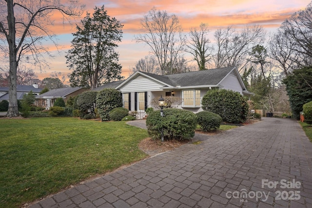 view of front of home featuring a yard