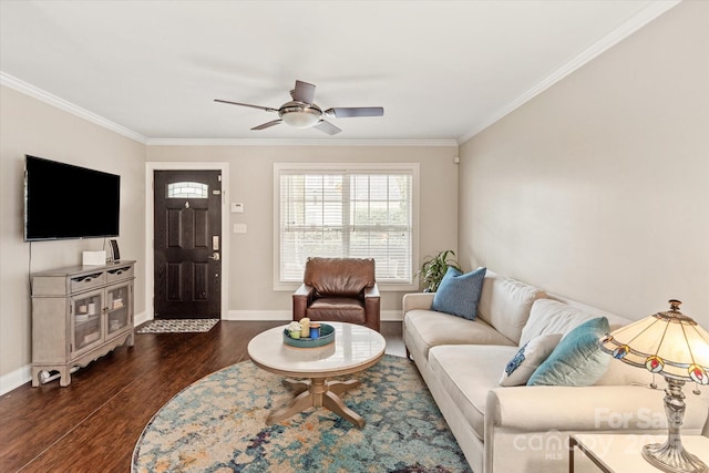 living area with dark wood-style flooring, crown molding, and baseboards