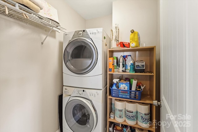 laundry room featuring laundry area and stacked washer / dryer