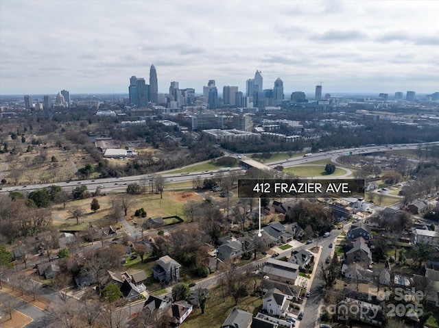 birds eye view of property featuring a city view