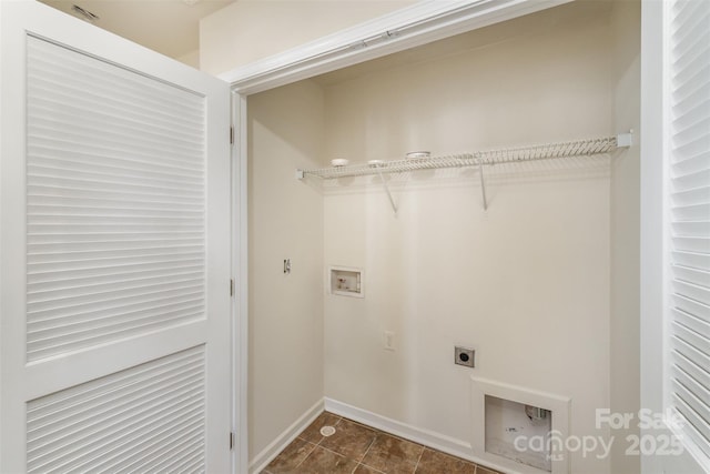 laundry area featuring hookup for a washing machine, laundry area, electric dryer hookup, and baseboards