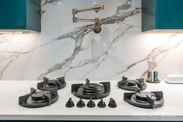 180 Willow Point Rd, Troutman, NC 28166 - detailed view of pot filler, light countertops, and gas stovetop