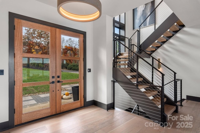 180 Willow Point Rd, Troutman, NC 28166 - foyer with wood finished floors, stairs, and french doors