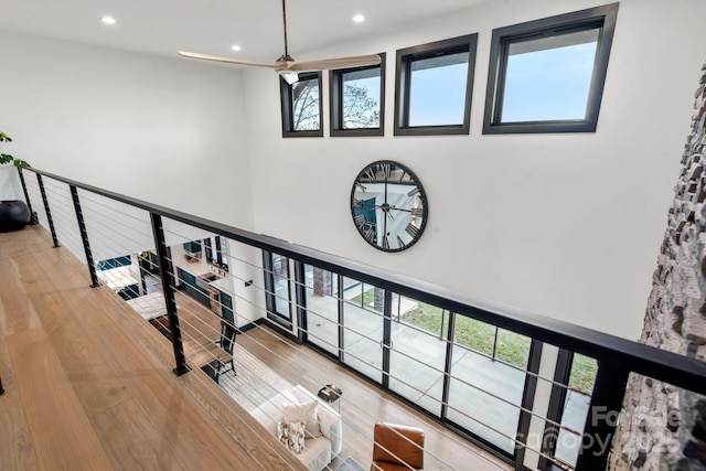 180 Willow Point Rd, Troutman, NC 28166 - stairway featuring recessed lighting, a towering ceiling, and wood finished floors