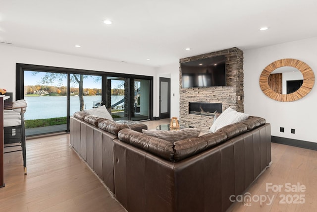 180 Willow Point Rd, Troutman, NC 28166 - living area with light wood-type flooring, a fireplace, and recessed lighting