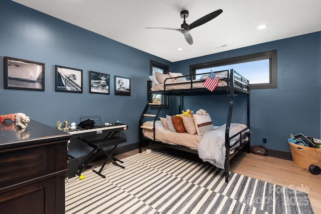 180 Willow Point Rd, Troutman, NC 28166 - bedroom with light wood finished floors, multiple windows, a desk, a ceiling fan, and recessed lighting
