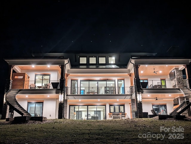 180 Willow Point Rd, Troutman, NC 28166 - rear view of house with stairway, a balcony, and stucco siding