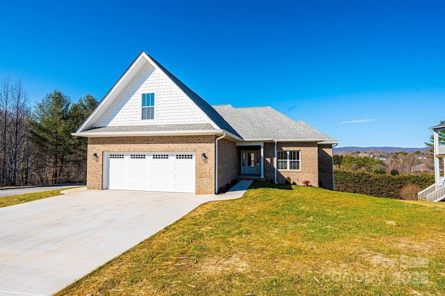 view of front of property with a garage and a front yard