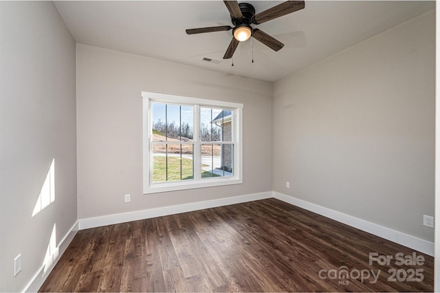 unfurnished room featuring dark wood-type flooring and ceiling fan