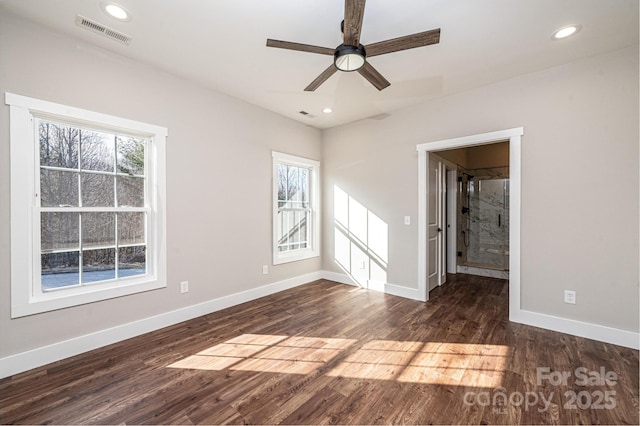 unfurnished room with ceiling fan and dark hardwood / wood-style flooring