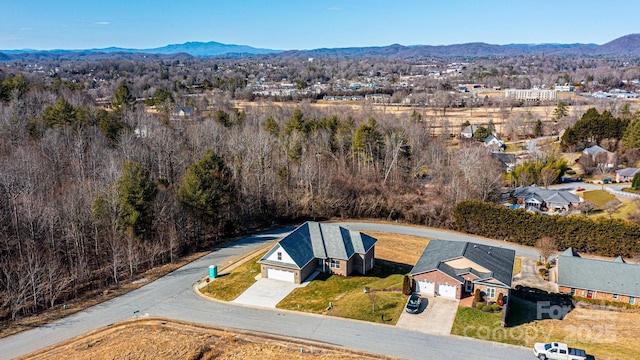 drone / aerial view featuring a mountain view