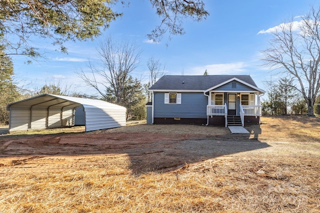 view of front of home with a carport and covered porch