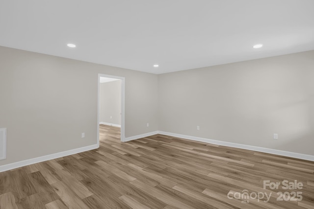 spare room featuring light hardwood / wood-style floors