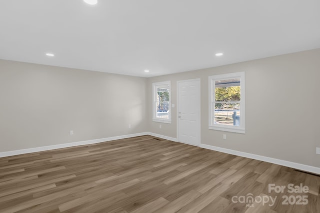 unfurnished room featuring light hardwood / wood-style flooring