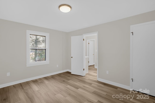 spare room with light wood-type flooring