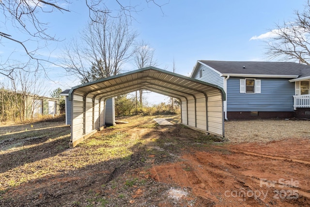 view of vehicle parking featuring a carport