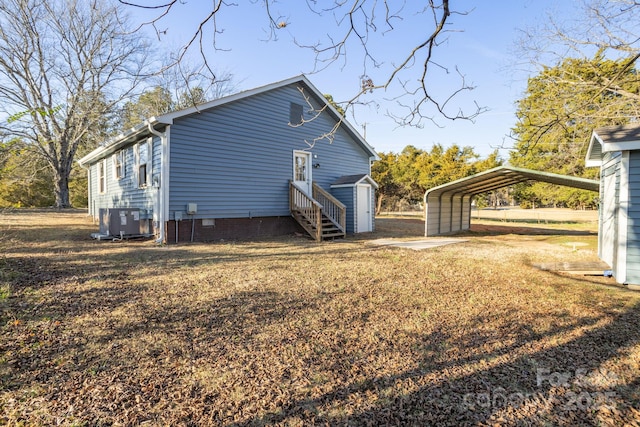 view of property exterior with a carport, a storage unit, and central air condition unit