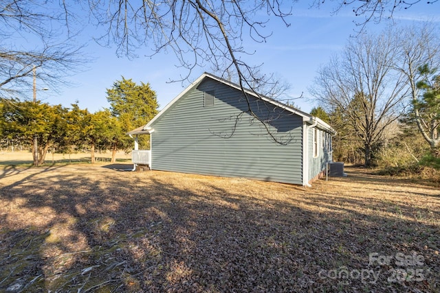 view of side of home featuring central AC unit