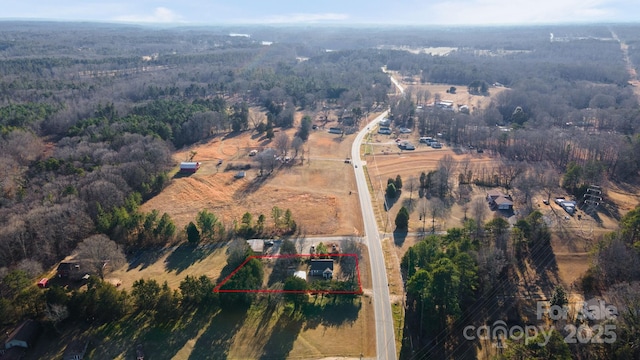 birds eye view of property featuring a rural view