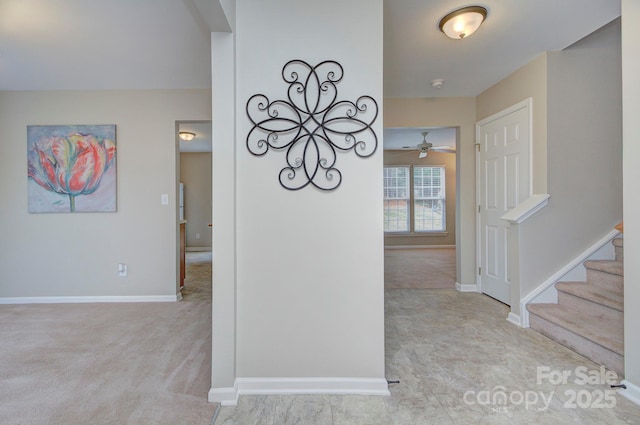 hallway featuring light carpet