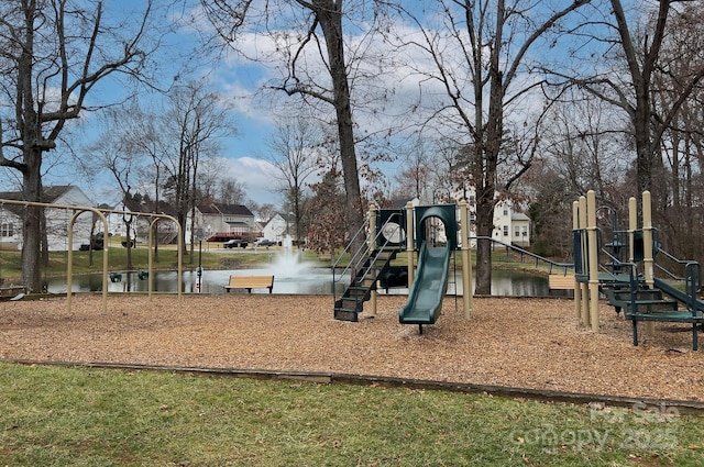 view of jungle gym with a water view