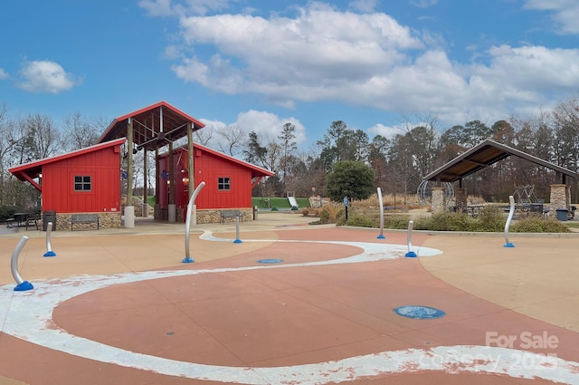 view of property's community with a playground