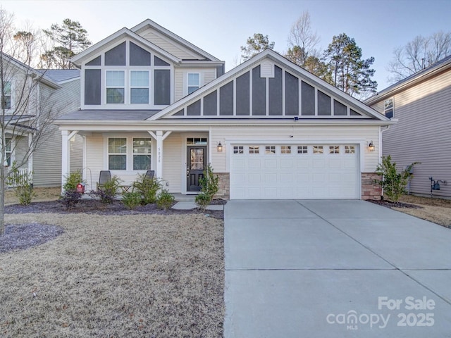 view of front facade with a garage and a porch