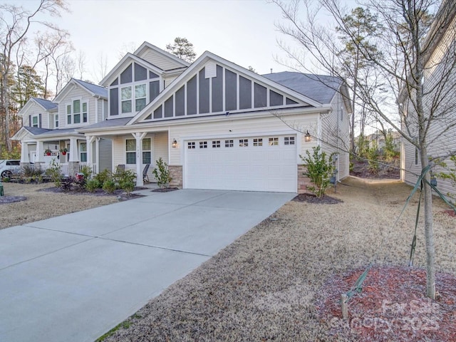 view of front of property featuring a garage and a porch