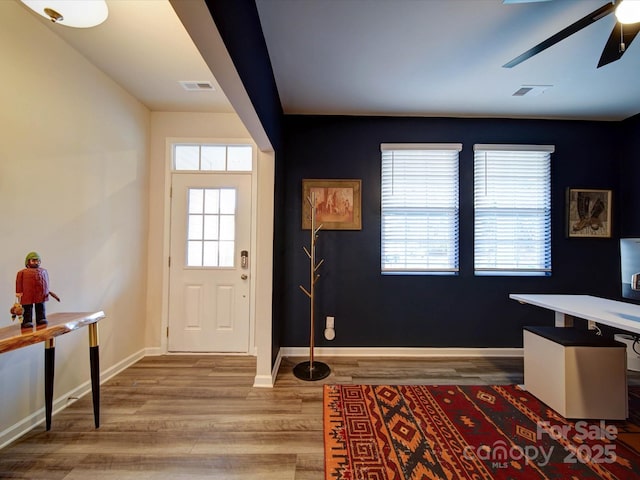 foyer featuring hardwood / wood-style flooring and ceiling fan